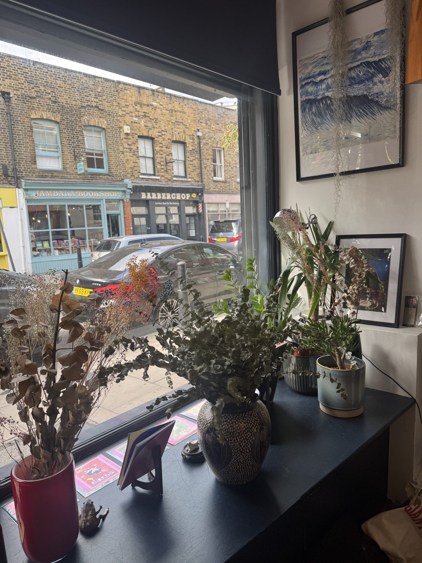 Ceramic vases and dried flowers in the shop window