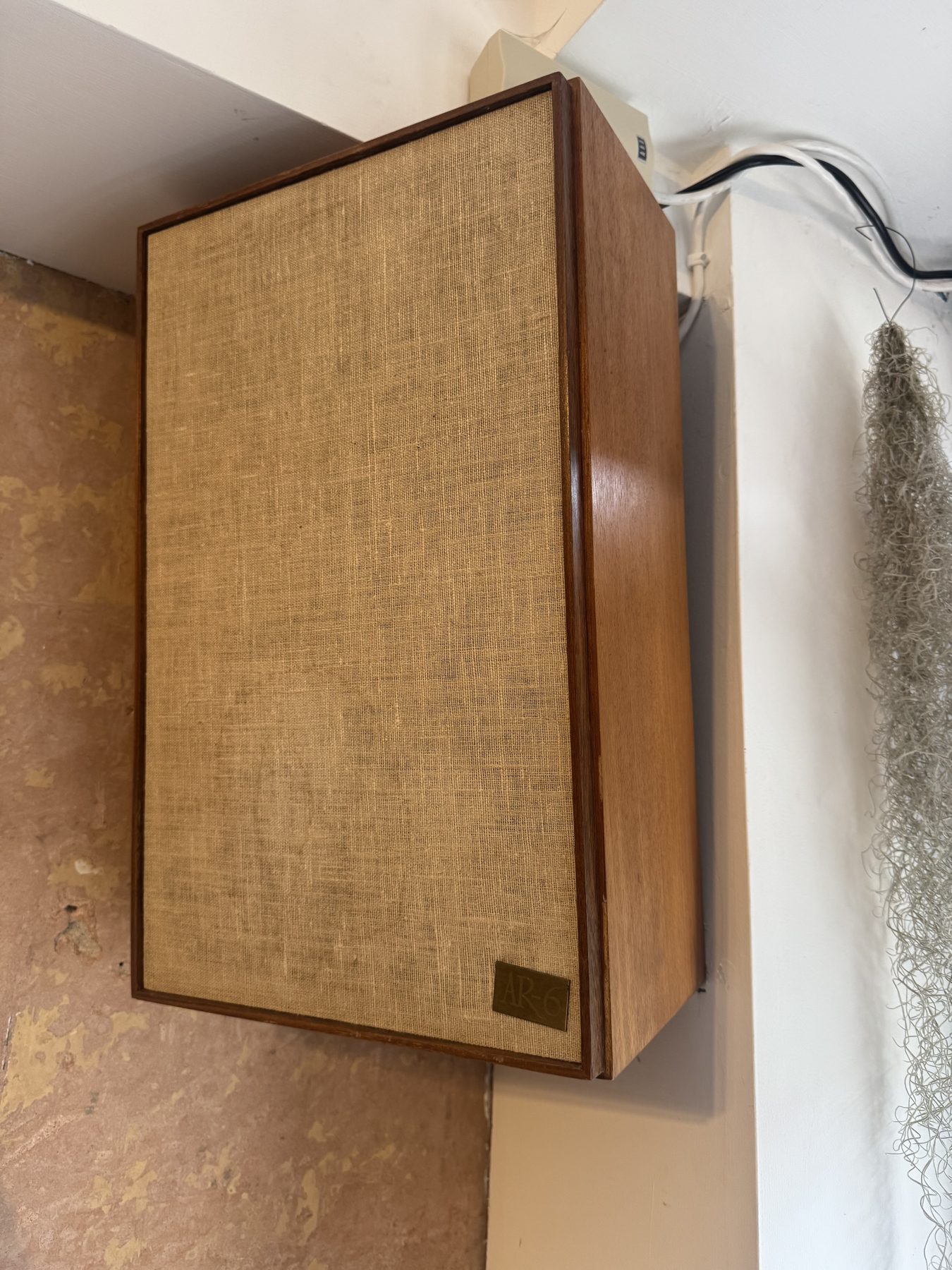 Vintage speaker with linen grille on the wall