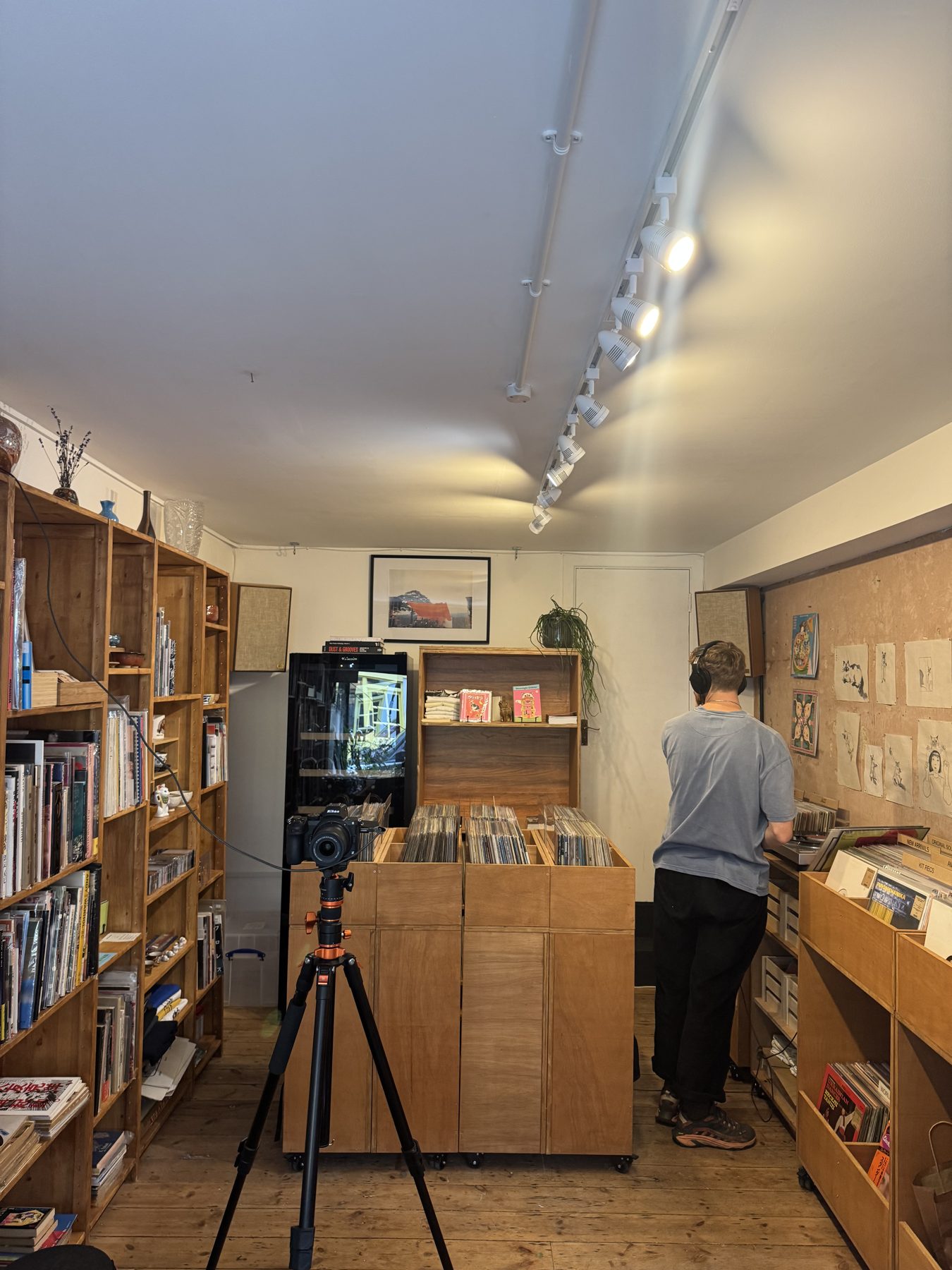 Camera on a tripod filming a session in the shop